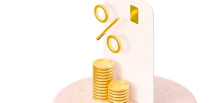 tarjeta de credito y monedas doradas